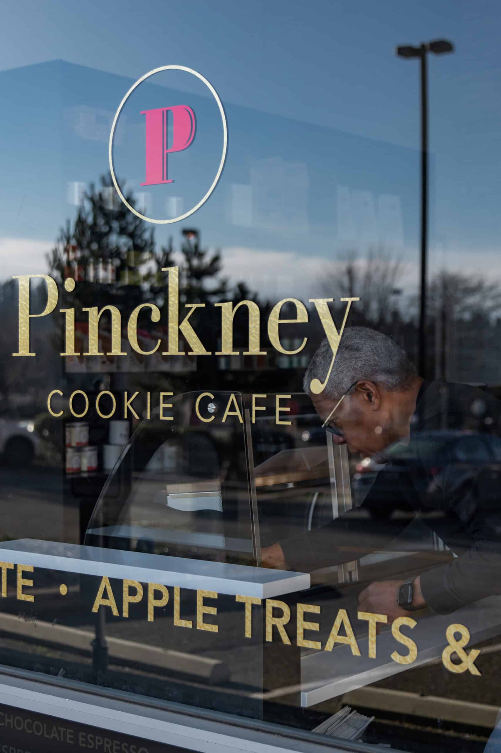 Exterior view of Pinckney Cookie Cafe with signage and window display.