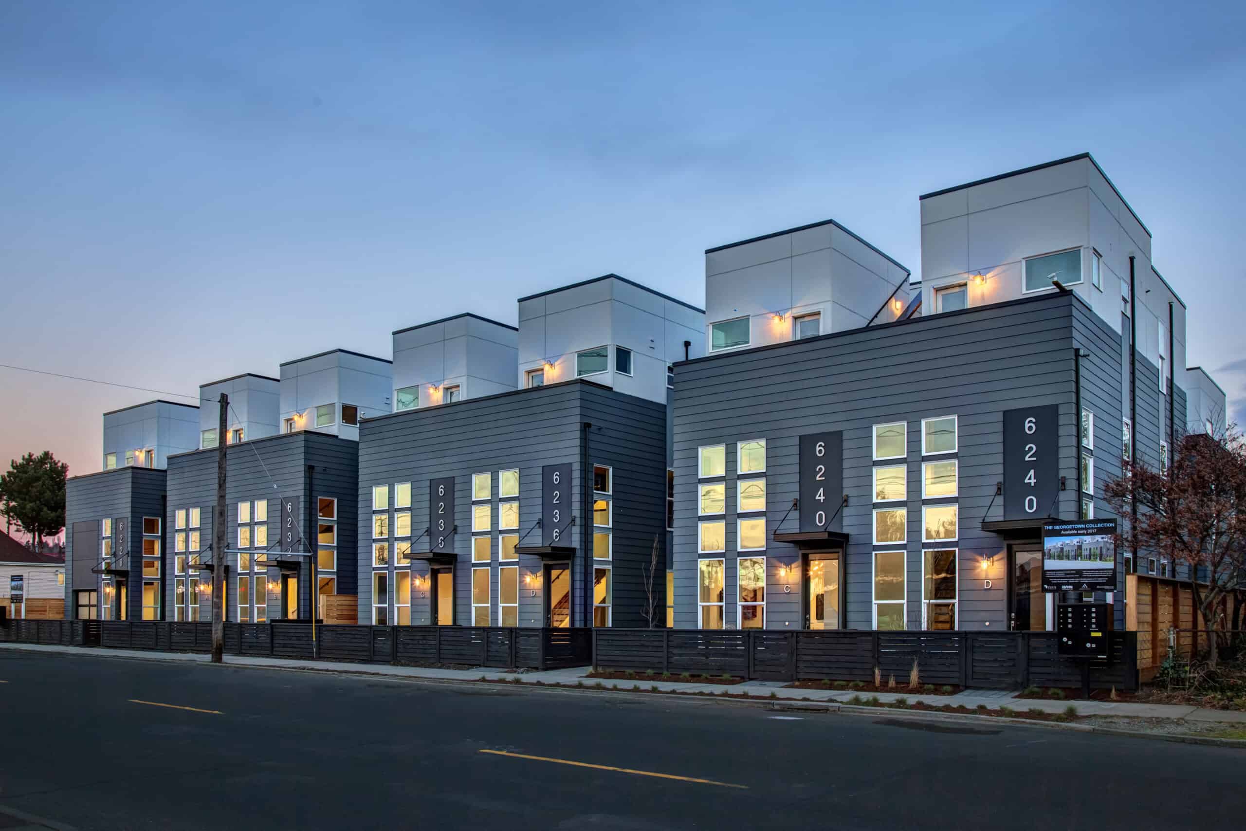 Modern multi-story residential buildings with unique cube-shaped upper floors.