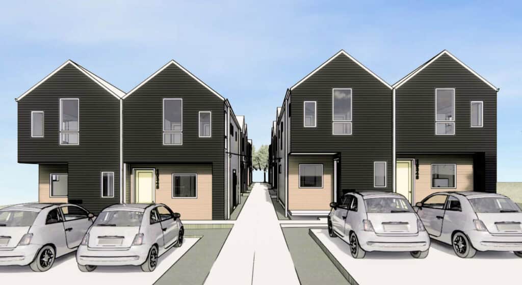 Modern black residential townhouses with parking area in front.