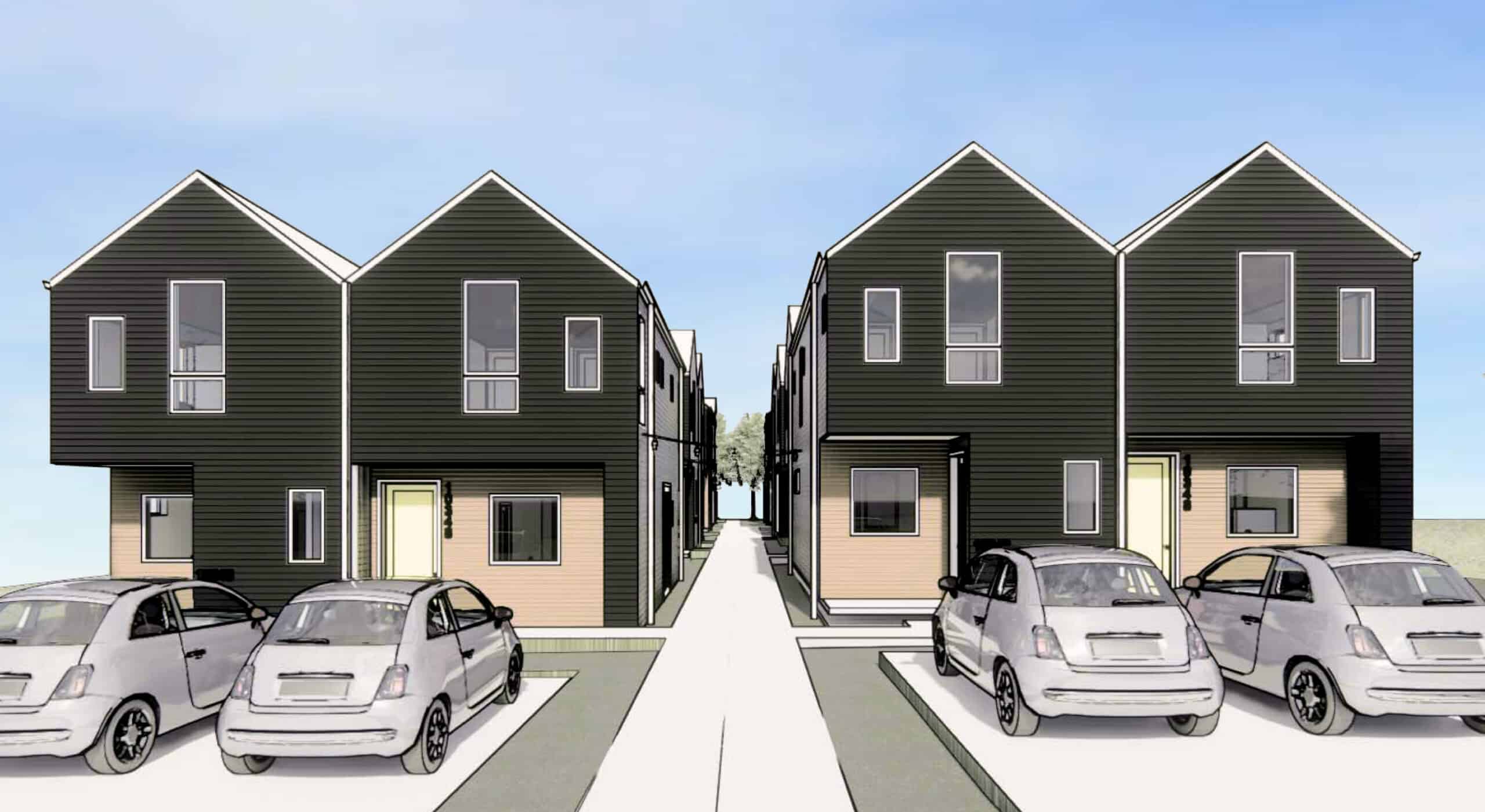 Modern black residential townhouses with parking area in front.