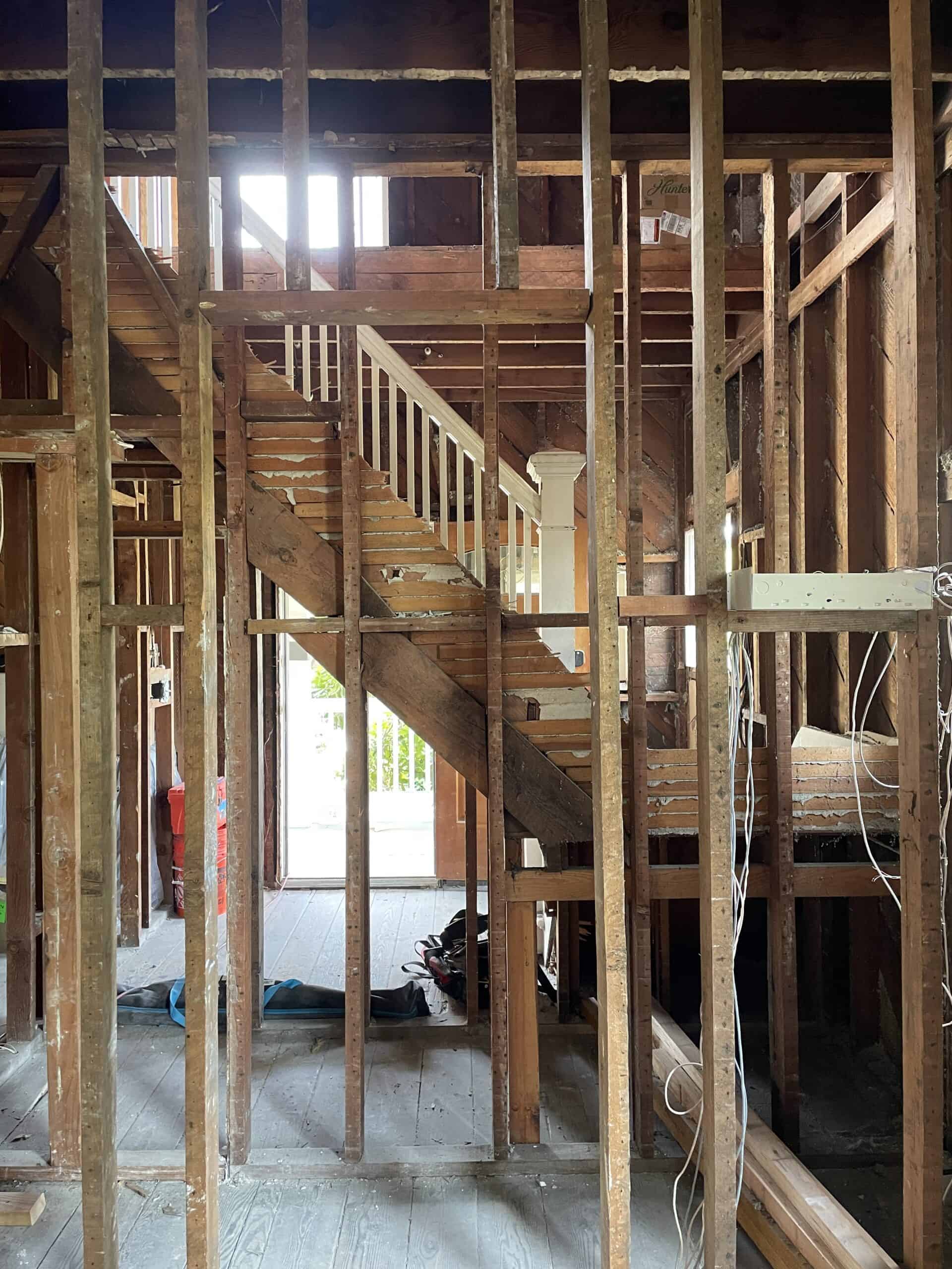 Wooden staircase under construction in a building site.