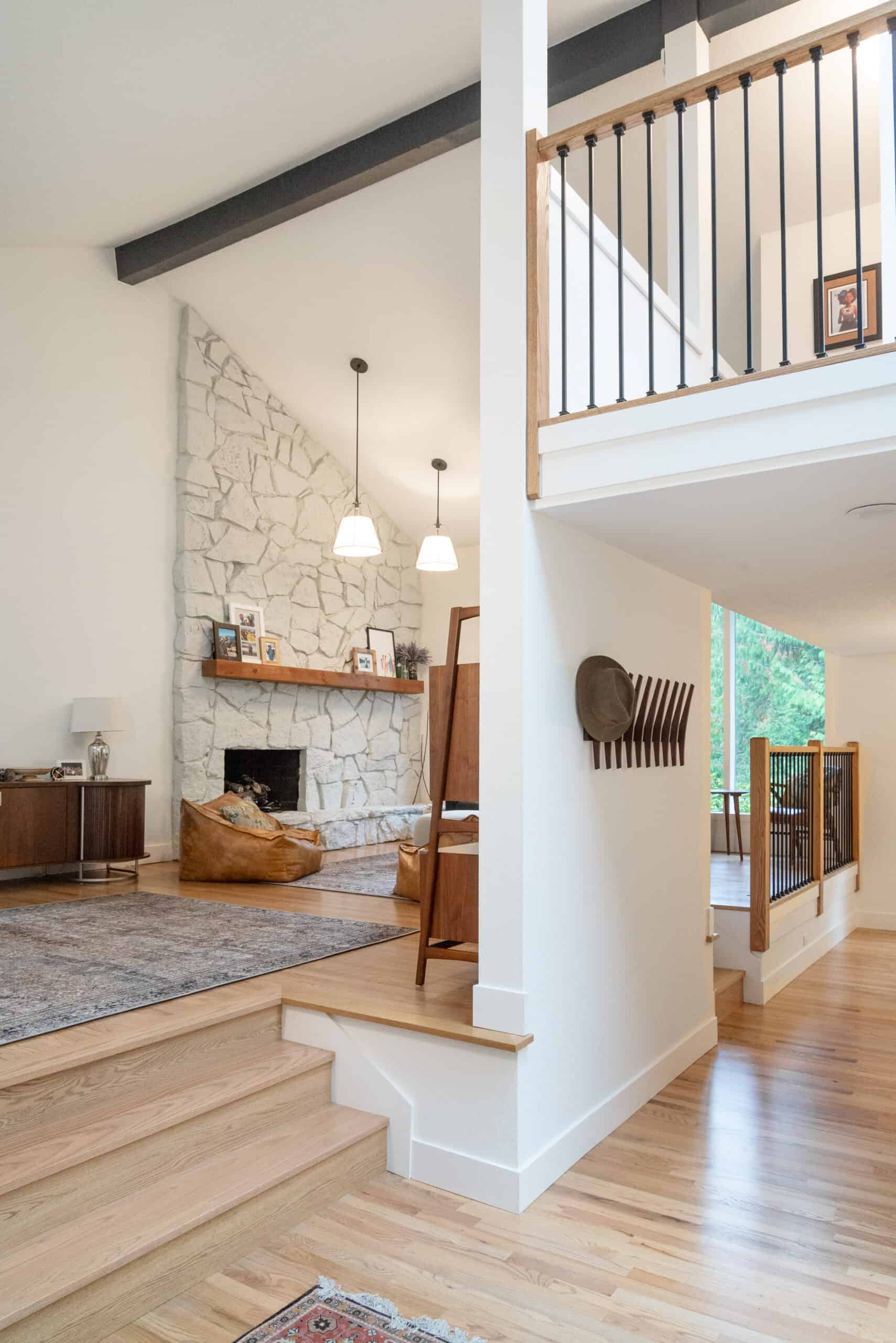 Bright, modern interior with stone fireplace and wooden accents in office space.