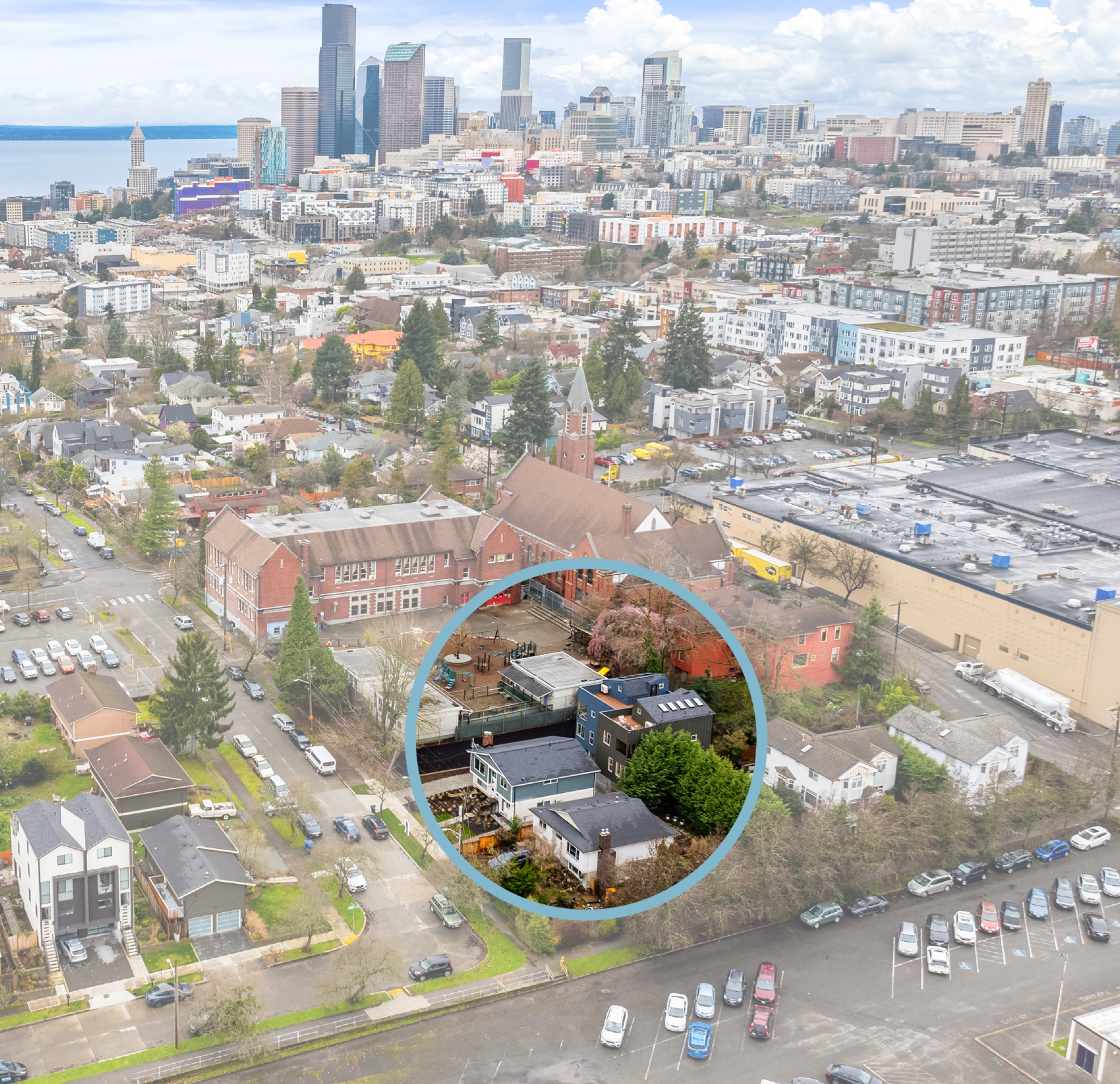 Aerial view of Seattle with focus on a small building circled in blue.
